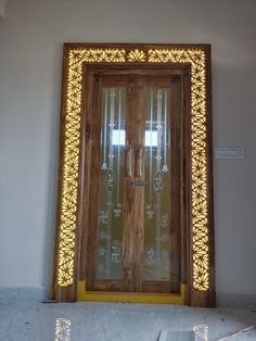 a large wooden door with glass panels on the front and side doors are lit up