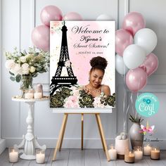 a welcome sign with balloons and flowers in front of the eiffel tower for someone's birthday