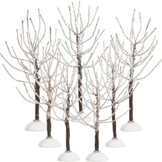 four small white trees with snow on them