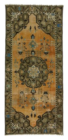 an antique rug with many different colors and patterns