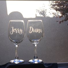 two wine glasses sitting next to each other