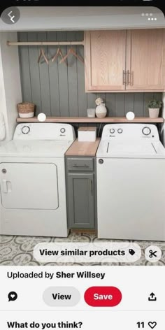 a small laundry room with washer and dryer on the floor, next to cabinets