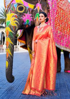 Ceremonial Royal Orange Gold Woven Kanjivaram 123001 Desc: Elegancy and Simplicity of this Kanjivaram saree easily attract eyes. With exquisite design spread across the length of the saree it is perfect for any occasion. Saree length : 5.5 meterBlouse piece :  0.8 meterFabric : Blended silk. With Express Free Shipping Buy Indian Party wedding wear Kanchipuram Silk Saree Ceremonial Royal Orange Gold Woven Kanjivaram 123001 online in USA, UK and Canada from KollyBollyEthnics.com Self Design Pre-draped Saree For Navratri, Navratri Meenakari Pre-draped Saree For Puja, Pre-draped Meenakari Saree For Puja And Navratri, Navratri Puja Pre-draped Saree With Meenakari, Meenakari Blouse Piece For Puja And Eid, Orange Self Design Blouse For Traditional Ceremonies, Orange Self-design Blouse For Traditional Ceremonies, Anarkali Meenakari Pre-draped Saree For Festivals, Anarkali Orange Saree With Zari Weaving