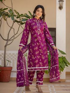 This 3-piece set includes purple cotton floral print straight shape pakistani style kurta has mandarin, full sleeves, scalloped hem, calf length teamed with printed trouser pants has elasticated waistband & slip on closure and a printed voile dupatta. Washing instructions state to hand wash. The model wearing the size small is 5'8 in height. 3 Piece Set Color-Purple Suit Fabric- Cotton Dupatta Fabric-Voile Work - Floral Print detailing Neck - Mandarin Collar Sleeves - Full Sleeves Length-Calf Le Purple Work, Pakistani Style, Purple Suits, Kurta Design, Trouser Design, Purple Floral Print, Dupatta Set, Weave Fabric, Colour Purple