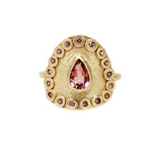 This stunning statement ring features a sparkling pink tourmaline outlined by over a dozen cognac African sapphires. The colors of the stones really play off of each other, making this piece a real showstopper. The handcrafted qualities of this ring really sing with the hammer set stones and my signature texture. Process: Casting, Fabrication Materials: Solid 18K Yellow Gold, .8ct Ethically Sourced Pear Shaped Pink Tourmaline, Ethically Sourced Cognac African Sapphires Ring Size: Ready to ship i Future Engagement Rings, Rings Unique, My Signature, Wedding Rings Unique, Tourmaline Ring, Pearl Gemstone, Gold Collection, Contemporary Jewelry, Pink Tourmaline