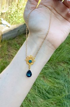 This is one of the beautiful necklaces that Kate wears in season 2. It reminds me of a peacock with the shape and teal blue colors. It is made with a gold tone filigree that has a teal blue rhinestone set into the center. Another teal blue drop rhinestone hangs from the bottom. Choose your preferred length, as shown it is 16 inches. This lovely piece makes a great gift for a loved one or yourself. Elegant Blue Peacock Design Jewelry, Blue Filigree Necklace For Wedding, Elegant Peacock Pendant Necklace, Elegant Peacock Color Pendant Necklace, Ornate Peacock Design Necklace For Gift, Teal Necklace, Gold Peacock, Blue Stone Necklace, Teal Blue Color