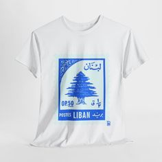 Embrace the rich cultural heritage of Lebanon with our exclusive Lebanese Post T-Shirt. This vintage-inspired tee features iconic designs that pay homage to the beauty and history of Lebanese post services. Perfect for those who appreciate unique and meaningful fashion, this shirt is a blend of comfort, style, and cultural pride. Key Features: Unique Design: The Lebanese Post T-Shirt showcases intricate patterns and motifs inspired by traditional Lebanese post stamps and symbols. Premium Quality Traditional Short Sleeve Graphic Print Top, Traditional Short Sleeve Tops With Graphic Print, Traditional Short Sleeve Shirt With Graphic Print, Traditional Short Sleeve T-shirt With Graphic Print, Traditional T-shirt With Graphic Print And Short Sleeves, Traditional Short Sleeve Graphic Print T-shirt, Vintage Lebanon, Middle Eastern Design, Post Stamps