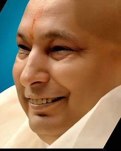 a close up of a person wearing a white shirt and tie with an orange spot on his forehead