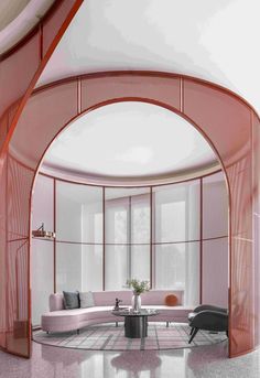 a living room with an arched glass wall