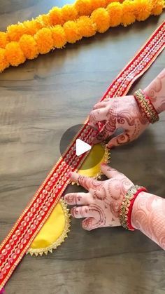 two hands with henna on each hand