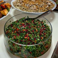 a table topped with lots of different types of food on top of plates and bowls