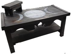 a table made out of wood with two different designs on the top and bottom, sitting in front of a white background