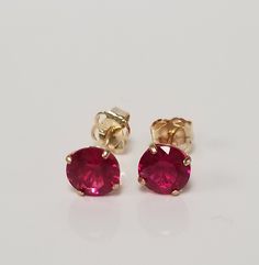 "Thanks for shopping our vintage estate store. We tend to sell well below wholesale and truly hope you enjoy all of our items. Many of the items are one of a kind, so please enjoy scrolling through the pictures and hopefully something will catch your eye. Brown spots are from camera or reflections. Nice estate 14k yellow gold created ruby or spinel studs. Color is red testing natural, but they are synthetic or created. Retails $189 on sale $59 Size: 3.5mm 1/8\" Weight: .54 gram Carat: .50ct per stud Nice studs, some that you will love, marked 14k and backs are included." Classic 14k Stamped Earrings For Anniversary, Vintage Round Cut Earrings For Gift, 14k Stamped Round Cut Earrings For Gift, Flower Birthday, Sparkly Ring, Pink Sapphire Ring, Earrings Flower, Brown Spots, Studs Earrings