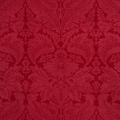 a red background with an ornate design on it's surface, and the colors are very