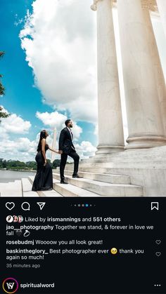 a man and woman standing in front of two white pillars with blue sky behind them