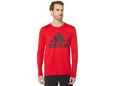 adidas Badge of Sport Long Sleeve Tee - Men's T Shirt : Scarlet 1 : Keep up with your day to day in the athletic and casual adidas Badge of Sport Tee. Regular fit T-shirt strikes a comfortable balance between loose and snug. Soft, breathable cotton fabric features a bold Badge of Sport logo in front. Crew neck. Short sleeves. Straight hem. 100% cotton. Machine wash, tumble dry. Imported. Measurements: Length: 27 in Product measurements were taken using size MD. Please note that measurements may Casual Sports T-shirt With Go-dry Technology, Sporty Long Sleeve T-shirt With Logo Print, Casual Athletic Heather Go-dry Tops, Casual Go-dry Athletic Heather Top, Adidas Logo Athleisure Tops With Relaxed Fit, Relaxed Fit Sportswear Activewear With Three Stripes, Sportswear Cotton Activewear With Three Stripes Branding, Cotton Sportswear With Three Stripes Branding, Casual Cotton Activewear With Three Stripes Branding