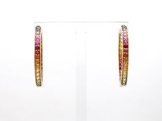 Rainbow sapphire hoops earrings in 14k 18k gold, Natural multi sapphire rainbow ombre hoops, Rainbow hoops earrings gold, Ready to ship gift EARRING DETAILS : ✦ Earring type : Hoops ✦ Earring length : 30 mm ✦ Earring closure : Hoops lock ✦ Earring weight : 5-6 grams for the pair ✦ Ready to ship variant : 14K Yellow Gold STONE DETAILS : ✦ Gemstone: Rainbow Sapphire ✦ Gemstone Type : Natural ✦ Gemstone Size : 2.00 mm ✦ Gemstone Shape : Round Cut ✦ Number of gemstones : 68 ✦ Gemstone Weight : 3-4 c Multicolor Fine Jewelry Hoop Earrings As Gift, Multicolor Gemstone Hoop Earrings In Fine Jewelry Style, Fine Jewelry Multicolor Hoop Earrings, Fine Jewelry Multicolor Hoop, Multicolor Hoop Fine Jewelry, Hoops Earrings Gold, Rainbow Ombre, Rainbow Sapphires, Multi Sapphire