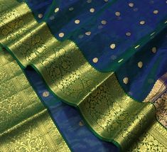 It's a beautiful Original chanderi handloom pure katan  silk saree . All over meenakari teeli work jaal handmade nakshi border including running plane blouse. Saree length: 6.40m, width: 46in  [ saree 5.50m, blouse 90cm ] Dry clean only . Please note - color may be vary a little due to sunlight and photography . Please message us after purchasing in case you want fall and Pico done it not . No extra charges for fall and Pico but inform us . Blouse stitching is also available . Traditional Kora Dupatta For Festive Occasions, Traditional Kora Dupatta For Festive Season, Festival Traditional Wear With Kora Embroidery, Bollywood Style Festive Kora Dupatta, Traditional Wear With Kora For Festivals, Elegant Kora Dupatta For Diwali, Traditional Drape Wear With Kora For Festivals, Diwali Kora Dupatta In Traditional Drape, Elegant Chanderi Dupatta With Kora