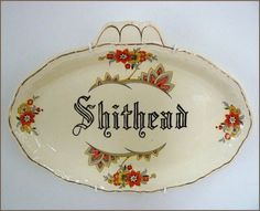 a platter with the word shitthread painted on it's side