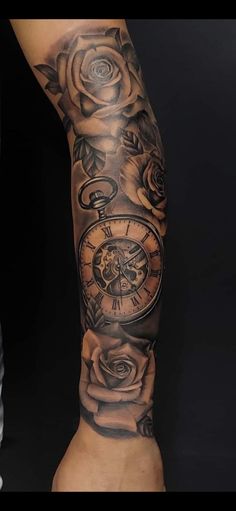 an arm with roses and a clock on it