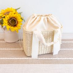 In Stock Fast Shipping from Los Angeles Experience the grandeur of the summertime with the elegantly crafted Elena Handbags Straw Beach Basket. This exquisite basket features intricate detail and durable straw construction, making it the perfect accessory for a stroll on the beach or a sunny picnic. With its timeless appeal, this bag creates a statement of sophistication for any discerning fashionista. Size: 24cm wide x 18cm tall (10in x 7in) Designer Style ID: 8277 Elena Handbags Summer Straw Beach Basket Handbag Cream Rectangular Bucket Bag For Beach, White Straw Summer Bag, Chic Woven Straw Bag For Summer Outings, White Straw Summer Bags, Cream Bucket Straw Bag For Vacation, Rectangular Cream Bucket Bag For Beach, Summer Woven Cream Bucket Bag, White Straw Beach Bag, White Basket Beach Bag For Spring