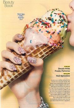 a woman eating an ice cream cone with sprinkles