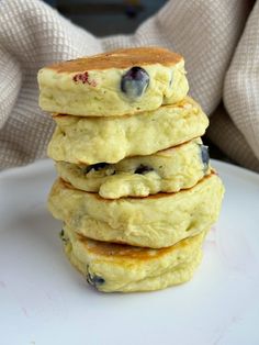 a stack of pancakes with blueberries on top