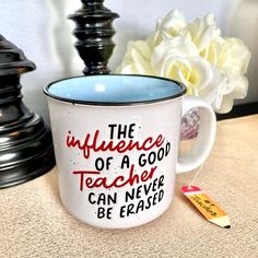 a coffee mug with the words, the influence of a good teacher can never be erased