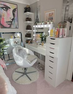 a white chair sitting in front of a mirror on top of a desk next to a dresser