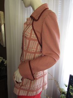 "60's/70's ladies--- maybe guys also----long sleeved big 3 1/2\"wide cuffed jacket with a tapered waist, pointy bust, big pointy collar, and side slot front pockets. Unlined jacket is in an abstract/geometric print in colors of orange, brown, pink polyester fabric. Jacket is by Atlas/Diolen Loft in a size 18. For the long ago era that it was designed for size 18. I'm guessing for now a probable large person fit, with it's tapered waist style. In excellent condition, very unique look. Measurement Retro Long Sleeve Brown Blazer, Retro Fitted Lined Outerwear, Retro Fitted Collared Outerwear, Fitted Retro Pink Outerwear, Retro Pink Outerwear For Fall, 1970s Long Sleeve Vintage Outerwear, 1970s Vintage Long Sleeve Outerwear, Spring Retro Lined Outerwear, Retro Fitted Long-sleeve Outerwear