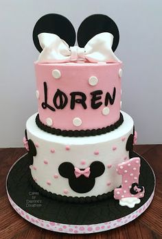 a minnie mouse birthday cake with pink and white frosting