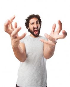 a man with his mouth open and hands in the air, making an obscene gesture