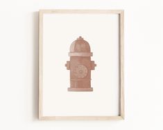 a wooden frame with a drawing of a fire hydrant on the wall above it