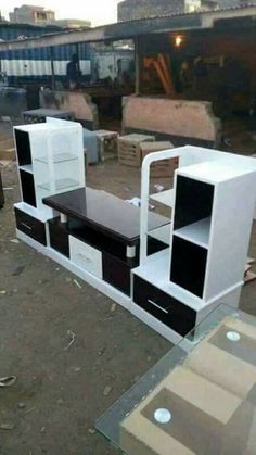 some kind of furniture that is sitting on the ground in front of other items and boxes