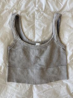 these tanks are made with super-elastic materials for maximum comfort & durability! they are one size fits most <3 they can be worn with the v neck in the front or the back depending on the look you’re going for! worn with the “do it” zip up! Gray Seamless Sleeveless Crop Top, Seamless Sleeveless Gray Crop Top, Comfortable Stretch Gray Tops, Comfortable Gray Stretch Top, Casual Gray Crop Top For Everyday, Stretch Gray Tank Top Vest, Trendy Gray Vest Top, Casual Gray Scoop Neck Tank Top, Gray Ribbed Tank Top For Summer