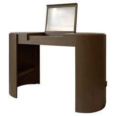 a computer desk with a laptop on top of it and a drawer underneath the desk