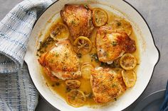 chicken with lemons and onions in a skillet