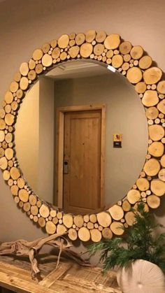 a mirror that is made out of wood logs