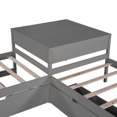 a metal bed frame with two drawers on each side and one drawer open to show the bottom