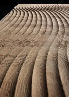 a close up view of a wooden structure with wavy lines