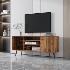 an entertainment center with a television on the wall