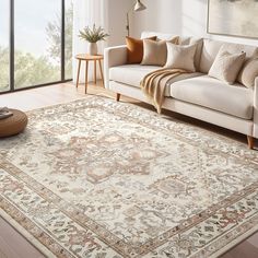 a living room with a couch, rug and window overlooking the outdoors in front of it