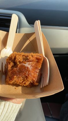 a piece of cake and fork in a cardboard box