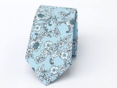 "Light Blue 936 Floral Wedding Tie, Wedding Men's Tie, Light Blue 914 Floral Bow Tie, Light Blue 914 Floral Pocket Square Light blue floral Wedding tie is one of our most favorite groomsmen ties chosen to outfit wedding party. The fine fabric on this necktie gives off the great shine and looks great at any formal or informal gatherings. Even though this light blue floral men's tie is so popular for weddings, it is still an ideal choice for business attire. Great design and texture tie gives you more confidence and attracts more attention.  This light blue floral bow tie is ideal for those that are looking for a trendy tie that adds color to the shirt without being too flashy or overpowering. Perfect for weddings, business meetings, casual throw, and proms! This classy tie is a great finish Blue Suit And Tie Accessories For Wedding, Blue Classic Wedding Suit And Tie Accessories, Blue Suit And Tie Accessories For Groom, Elegant Light Blue Suit And Tie Accessories For Wedding, Blue Wedding Suit And Tie Accessories, Blue Fitted Suit And Tie Accessories For Wedding, Blue Wedding Ties, Floral Wedding Tie, Blue Floral Bow Tie