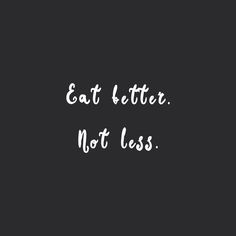 the words eat better not less are written in white ink on a black background,