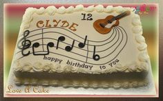 a sheet cake with music notes and a guitar on it that says clyde happy birthday to you