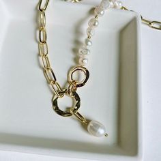 Introducing the HEBE necklace - a timeless classic of femininity and sophistication. This luxurious piece is crafted with freshwater pearls, for an effortless elegance that will last for years to come. Intricately designed to be dainty and delicate, it will become a treasured companion in any wardrobe. Perfect for special occasions or everyday wear, the HEBE necklace is an exquisite fashion statement. 16in long necklace ☆Lead and Nickel Free☆Lightweight☆14k Gold plated stainless steel☆Freshwater Gold Single Strand Feminine Necklace, Feminine Gold Single Strand Necklace, Long Pearl Pendant Chain Necklace, Long Pearl Chain Necklace With Pearl Pendant, Long Pearl Necklace With Pearl Charm, Feminine Pearl Chain Necklace, Feminine Pearl Clavicle Chain Jewelry, Feminine Pearl Drop Necklace, Everyday Pearl Charm Chain Necklace