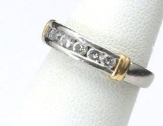 - Estate Jewelry Vintage Platinum & 18k Yellow Gold Shoulder with Diamond Wedding Band- Marked PT 900 and 18k, signed IK- 7 diamond rounds that each measure 2mm wide (diamonds have not been professionally graded)- Band measures 4.2mm tall and 3.3mm deep at face- Ring weighs 6.3- Ring band is pre-owned and has some dings and scratches to the platinum from wear (see pics) Platinum Jewelry With Gold Single Cut Diamonds, Gold Platinum Jewelry With Single Cut Diamonds, Platinum Jewelry With Single Cut Diamonds In Gold, Brilliant Cut Diamond Jewelry For Marriage, Luxury Jewelry With Prong Setting For Marriage, Anniversary Wedding Ring With Single Cut Diamonds, Luxury Jewelry For Marriage With Prong Setting, Classic Diamond White Jewelry For Marriage, Diamond Jewelry With Diamond Accents For Marriage