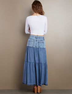 With a jeans-top/layered bottom construction, in our oh-so-soft trademark denim, the Fun Denim Maxi Skirt by Wash Lab is, well, built for fun! Fitted Cotton Bottoms For Layering, Cotton Bottoms For Layering In Spring, Spring Layering Cotton Bottoms, Casual Tiered Skirt Bottoms For Layering, Casual Tiered Skirt For Layering, Medium Wash Tiered Denim Skirt, Fitted Recycled Denim Bottoms For Spring, Spring Layering Tiered Skirt, Medium Wash Denim Tiered Skirt