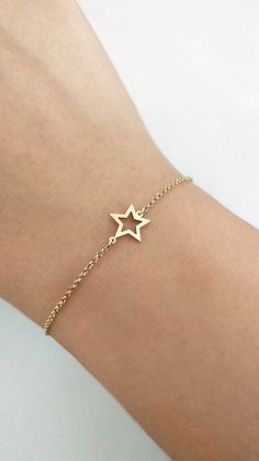 14K 9K Solid Gold Star Bracelet, Open Star Bracelet, Solid Gold Star Frame Bracelet, Dainty Star Charm Bracelet, Celestial Jewelry, Gift for Her, Gift for Daughter, Girlfriend Gift, FREE EXPRESS SHIPPING Beautiful and delicate bracelet with a small star frame charm made in 14K or 9K solid gold. Whisper...Reach for the Stars! Crescent Moon Bracelet: https://www.etsy.com/listing/747232649 Heart Bracelet: https://www.etsy.com/listing/737486490 -------------------------------------------------- D E Dainty Yellow Gold Star Bracelet, 14k Gold Star Charm Bracelet, 14k Gold Bracelet With Star Charm, 14k Gold Bracelets With Star Charm, Gold Star Charm Chain Bracelet, Gold Chain Bracelet With Star Charm, 14k Gold Star-shaped Bracelet Gift, 14k Gold Star Bracelet Gift, Gold Star-shaped Bracelet As Gift